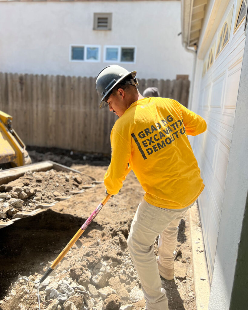 Man working in a concrete driveway